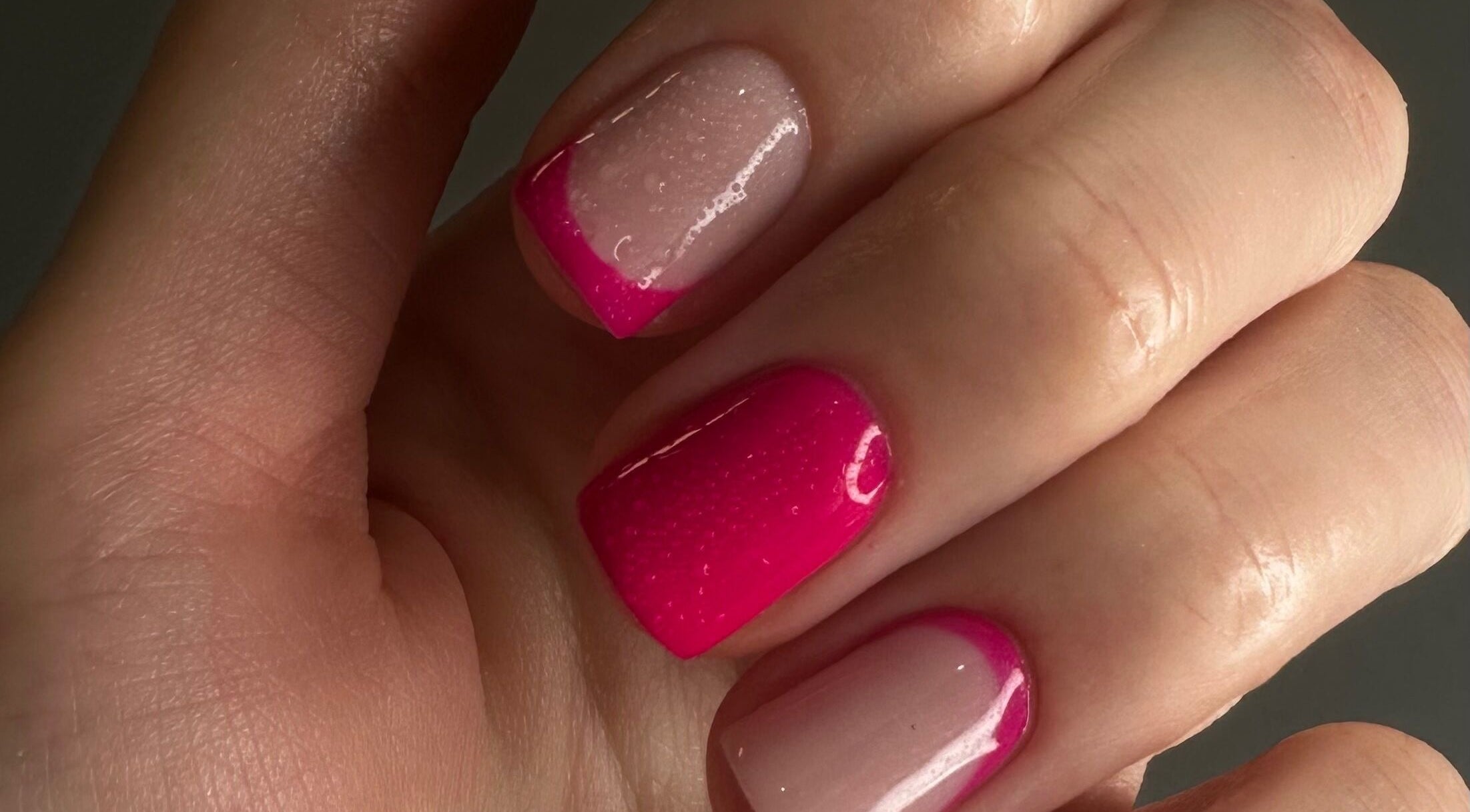 Vibrant pink nails at OF.LAMIMANI, Chicago, Illinois, US, showcasing exquisite nail art.
