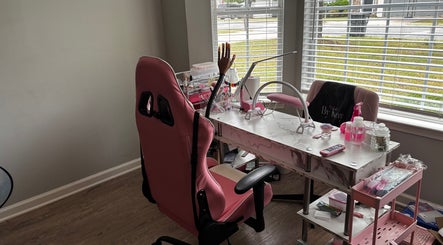 Nail station with pink decor at Nails By Kay, Villa Rica, Georgia, US, featuring modern tools and a window view.