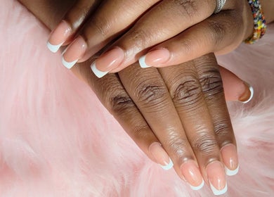 Elegant French manicure by Fab Nails - Mobile Nail Services, Newcastle upon Tyne, England, GB, on a soft pink background.
