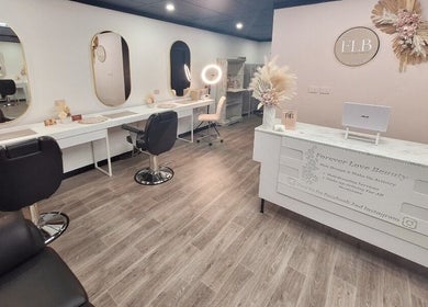 Modern beauty salon interior at FOREVER LOVE BRIDES, Pimlico, Queensland, AU featuring stylish stations and decor.