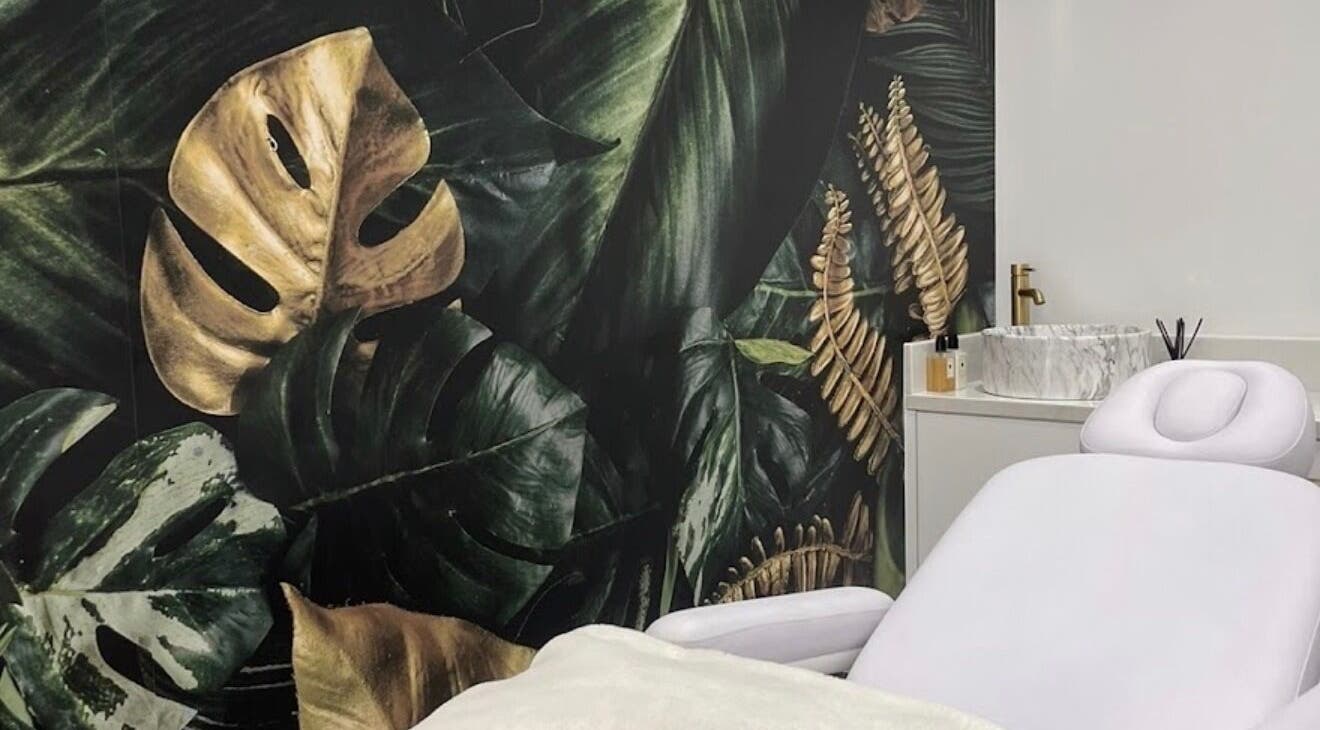 Relaxing treatment room at Parklawn Location, Toronto, Ontario, CA with lush tropical decor and spa bed.