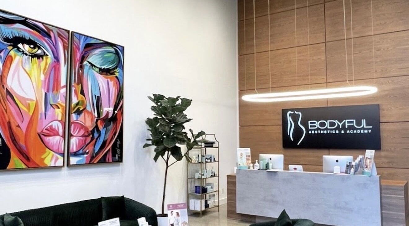 Reception area at Priness Beauty - Parklawn, Toronto, Ontario, CA with vibrant art and modern design.