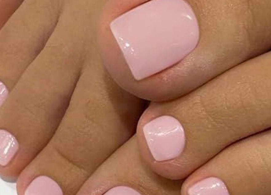 Elegant pink pedicure at The Beauty Barn, Wilton, England, GB offering premium nail care.