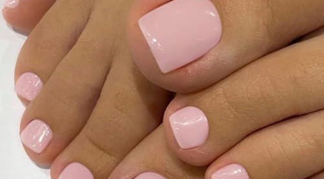 Elegant pink pedicure at The Beauty Barn, Wilton, England, GB offering premium nail care.