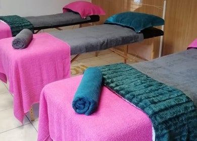 Relaxing massage beds at Bobbles Beauty Bar in Jeffreys Bay, Eastern Cape, ZA, ready for wellness sessions.