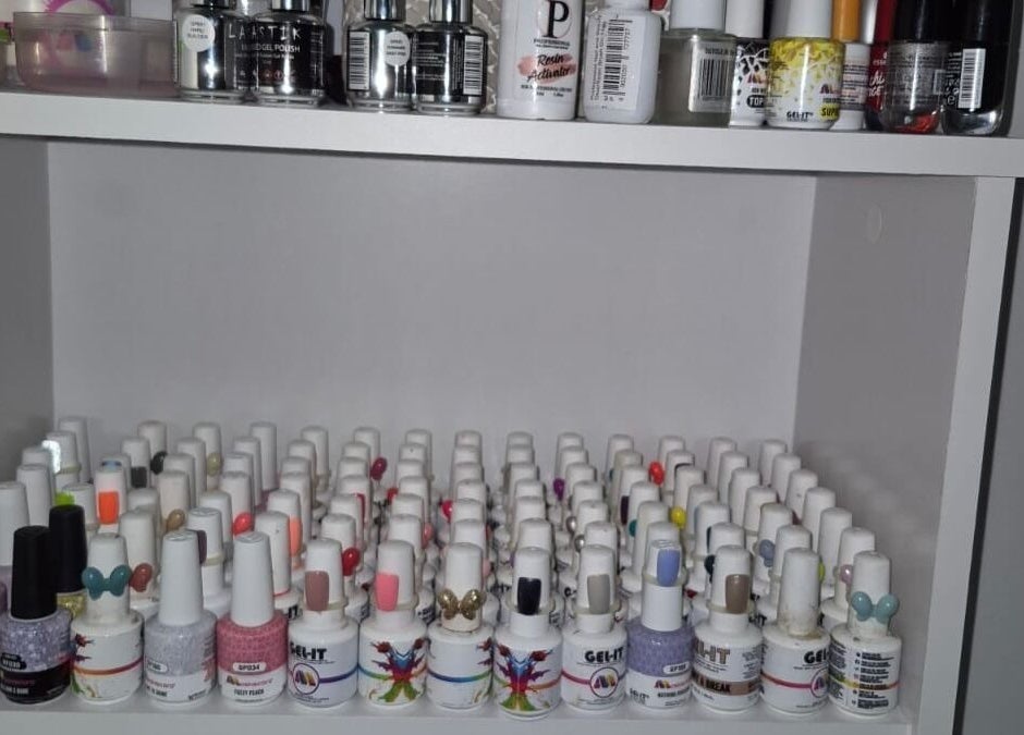 Diverse nail polish collection at Eksie Perfeksie Naels, Gqeberha, Eastern Cape, ZA. Explore vibrant colors.