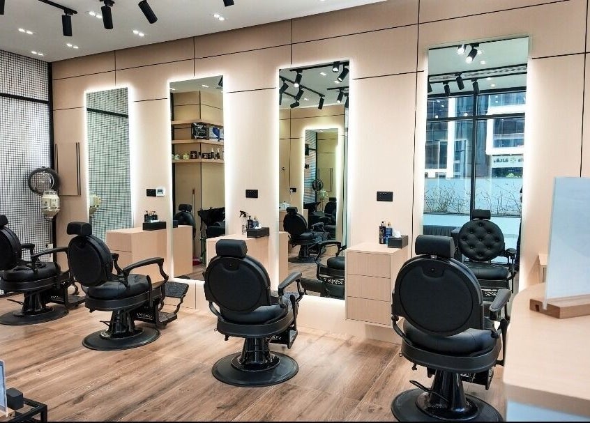 Stylish interior of M&W Gents Salon in Abu Dhabi, Abu Dhabi, AE with barber chairs and modern decor.