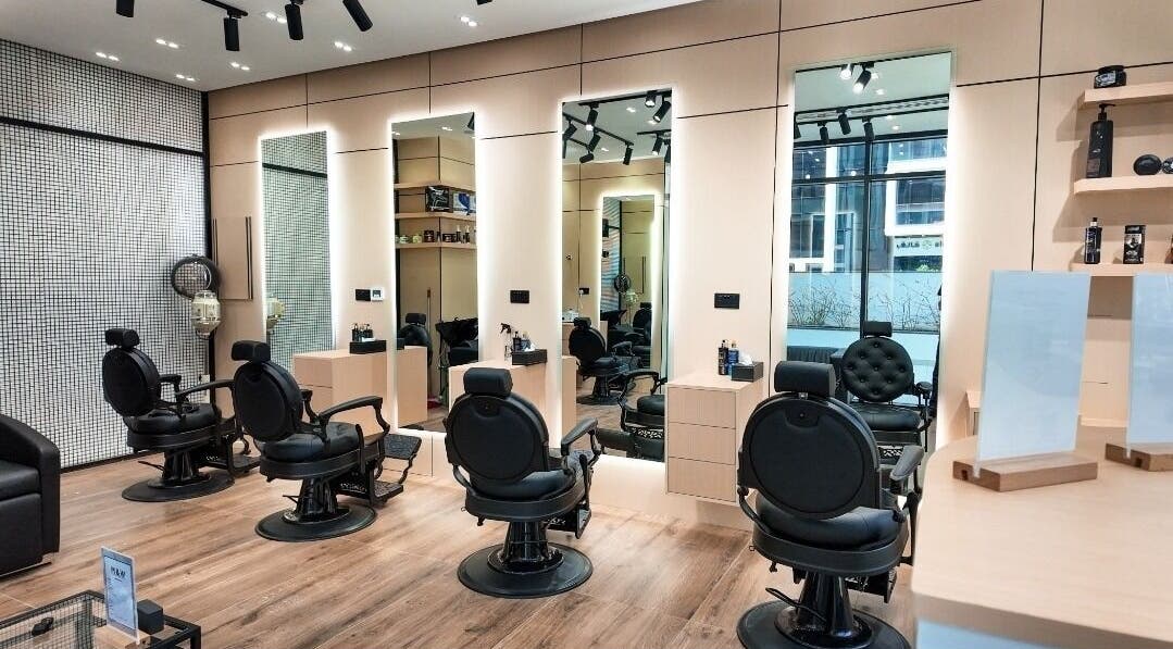 Stylish interior of M&W Gents Salon in Abu Dhabi, Abu Dhabi, AE with barber chairs and modern decor.