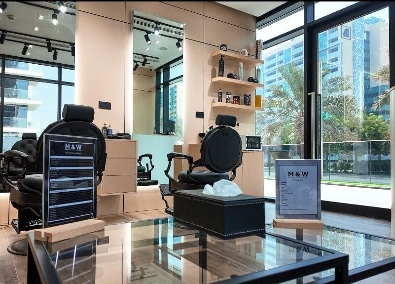 Chic interior of M&W Gents Salon, featuring stylish chairs and mirrors in Abu Dhabi, Abu Dhabi, AE.