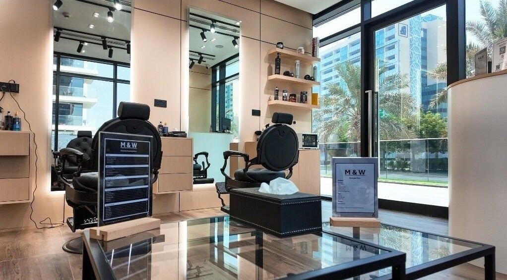 Chic interior of M&W Gents Salon, featuring stylish chairs and mirrors in Abu Dhabi, Abu Dhabi, AE.