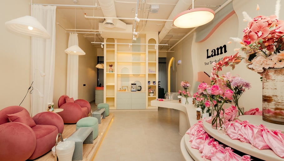 Chic interior of Lam Nails and Spa in Riyadh, Riyadh Province, SA with plush seating and floral decor.