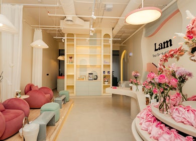 Chic interior of Lam Nails and Spa in Riyadh, Riyadh Province, SA with plush seating and floral decor.