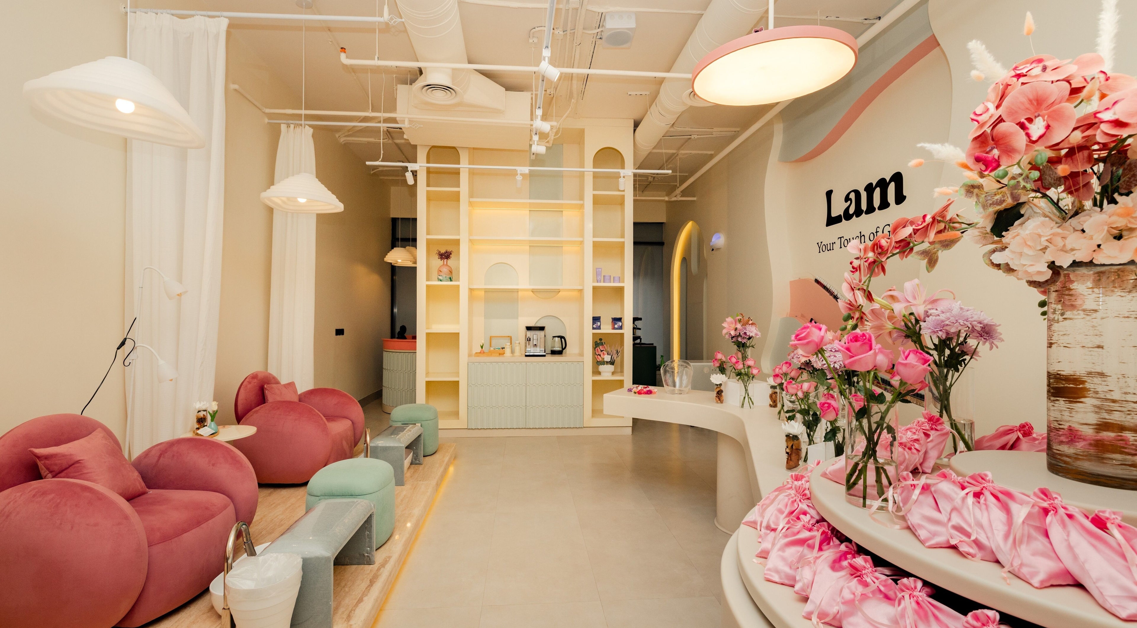 Chic interior of Lam Nails and Spa in Riyadh, Riyadh Province, SA with plush seating and floral decor.