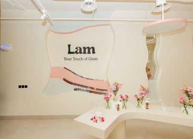 Stylish interior of Lam Nails and Spa in Riyadh, Riyadh Province, SA with decorative flowers and nail polish display.