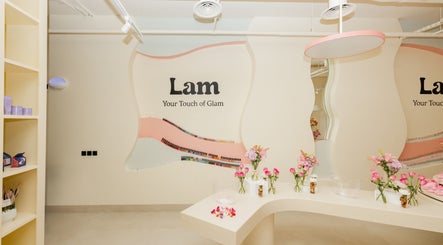 Stylish interior of Lam Nails and Spa in Riyadh, Riyadh Province, SA with decorative flowers and nail polish display.