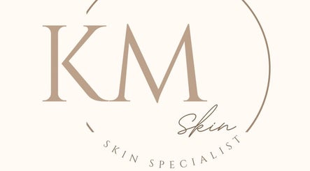 KM Skin logo with elegant script in Clydebank, Scotland, GB.