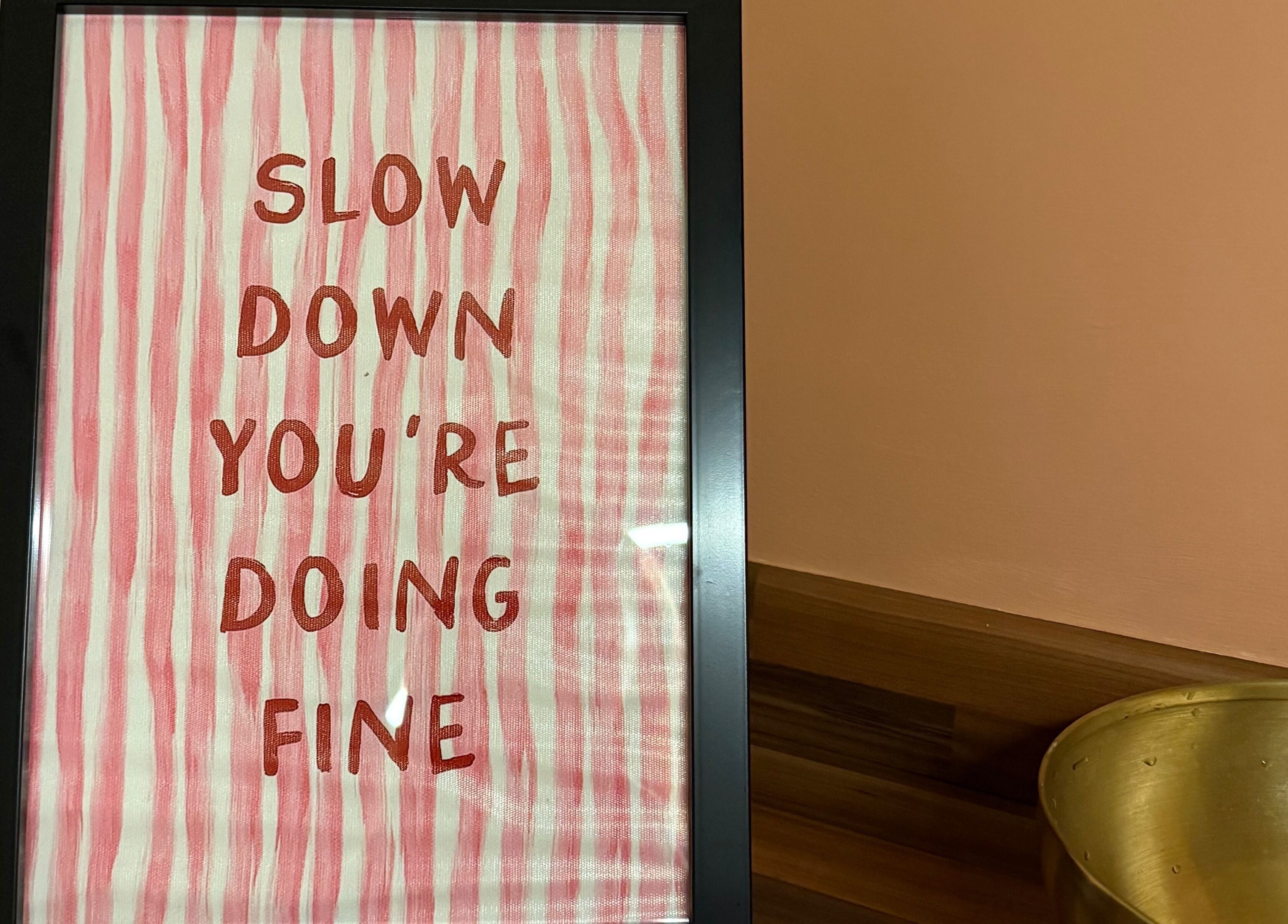 Inspirational quote art at KM Skin, Clydebank, Scotland, GB, encouraging self-care and mindfulness.