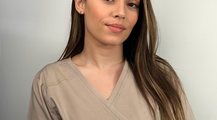 A professional beautician at Malora in Birkirkara, MT, offering exceptional wellness services.