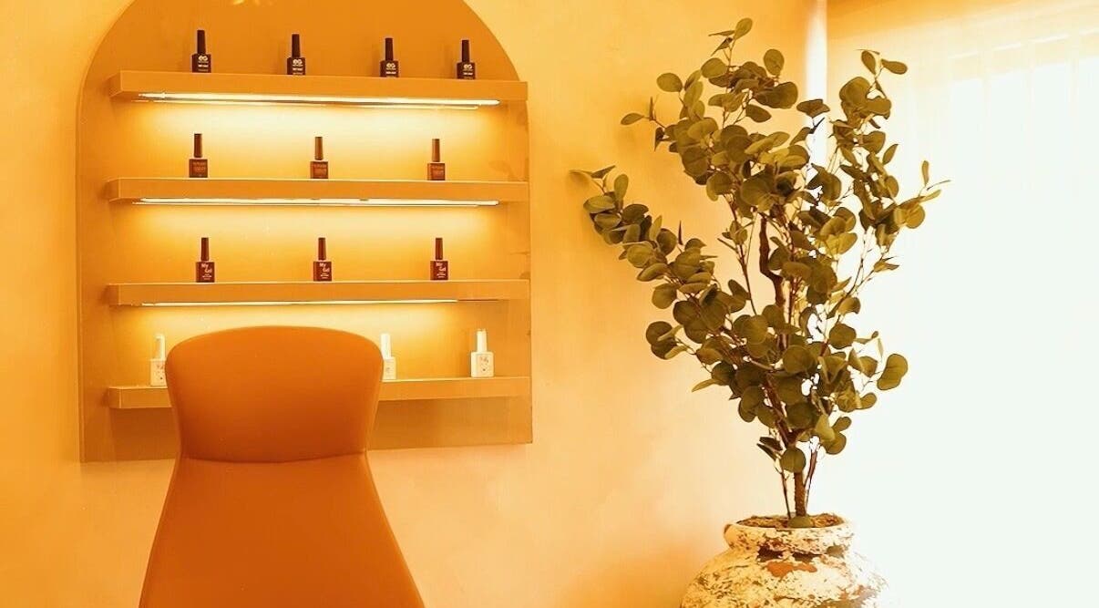 Cozy BK NAILS corner in Abuja with elegant nail polish display and greenery.