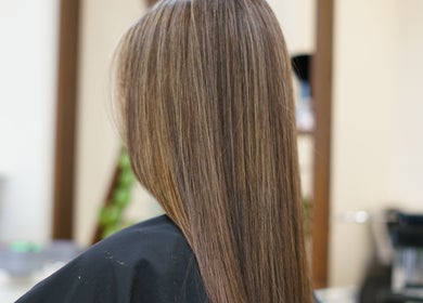 Smooth, straightened hair at Thi Vo Hair Salon in Calgary, Alberta, CA, showcasing expert styling.