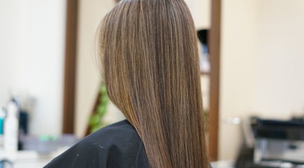 Smooth, straightened hair at Thi Vo Hair Salon in Calgary, Alberta, CA, showcasing expert styling.