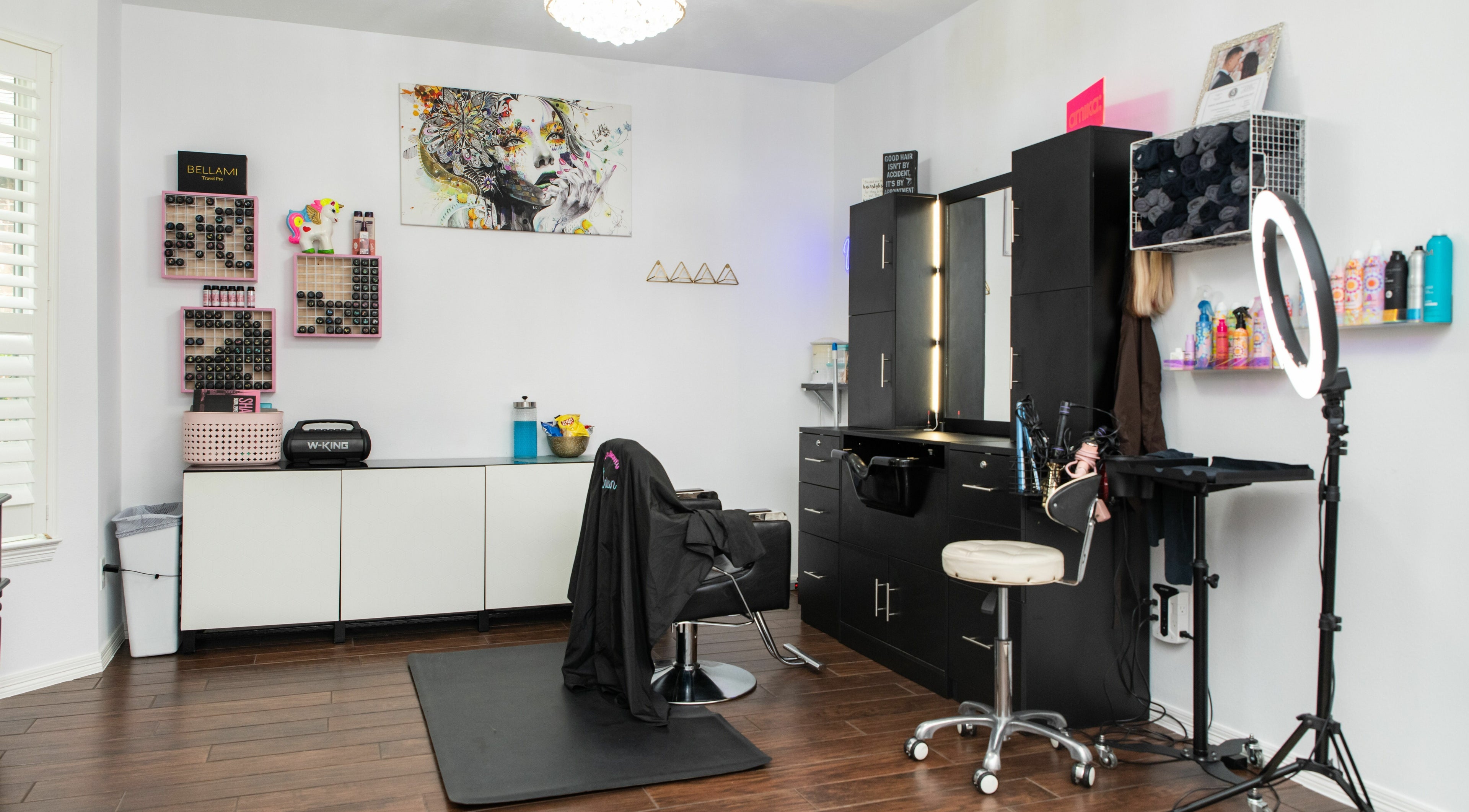 Chic styling station at Ellie's Beauty Salon in League City, Texas, US showcasing modern decor and vibrant atmosphere.