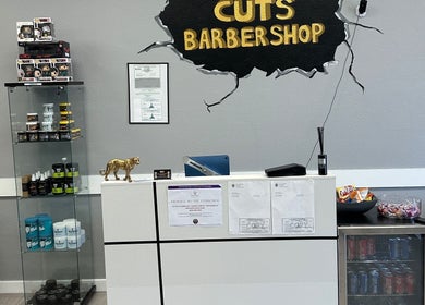 Reception at Maestro Cuts Barbershop in Van Nuys, California, US with product display and refreshments.