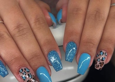Elegant blue and leopard nail art at A.S.K BEAUTY, Hayle, England, GB. A trendy and creative design.
