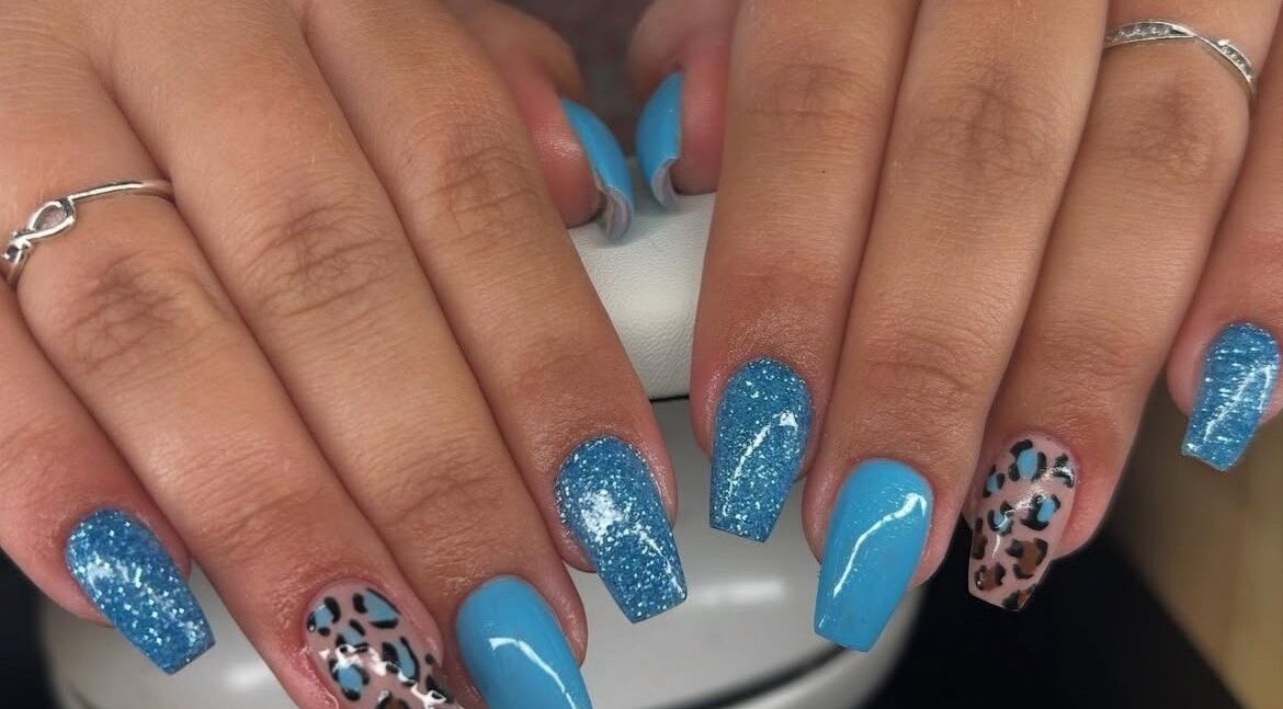 Elegant blue and leopard nail art at A.S.K BEAUTY, Hayle, England, GB. A trendy and creative design.