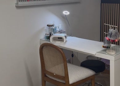 Elegant nail station at BayCo Beauty in Faringdon, England, GB with manicure tools and soft lighting.