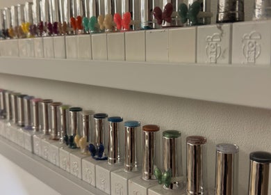Colorful nail polish bottles on a shelf at BayCo Beauty in Faringdon, England, GB.