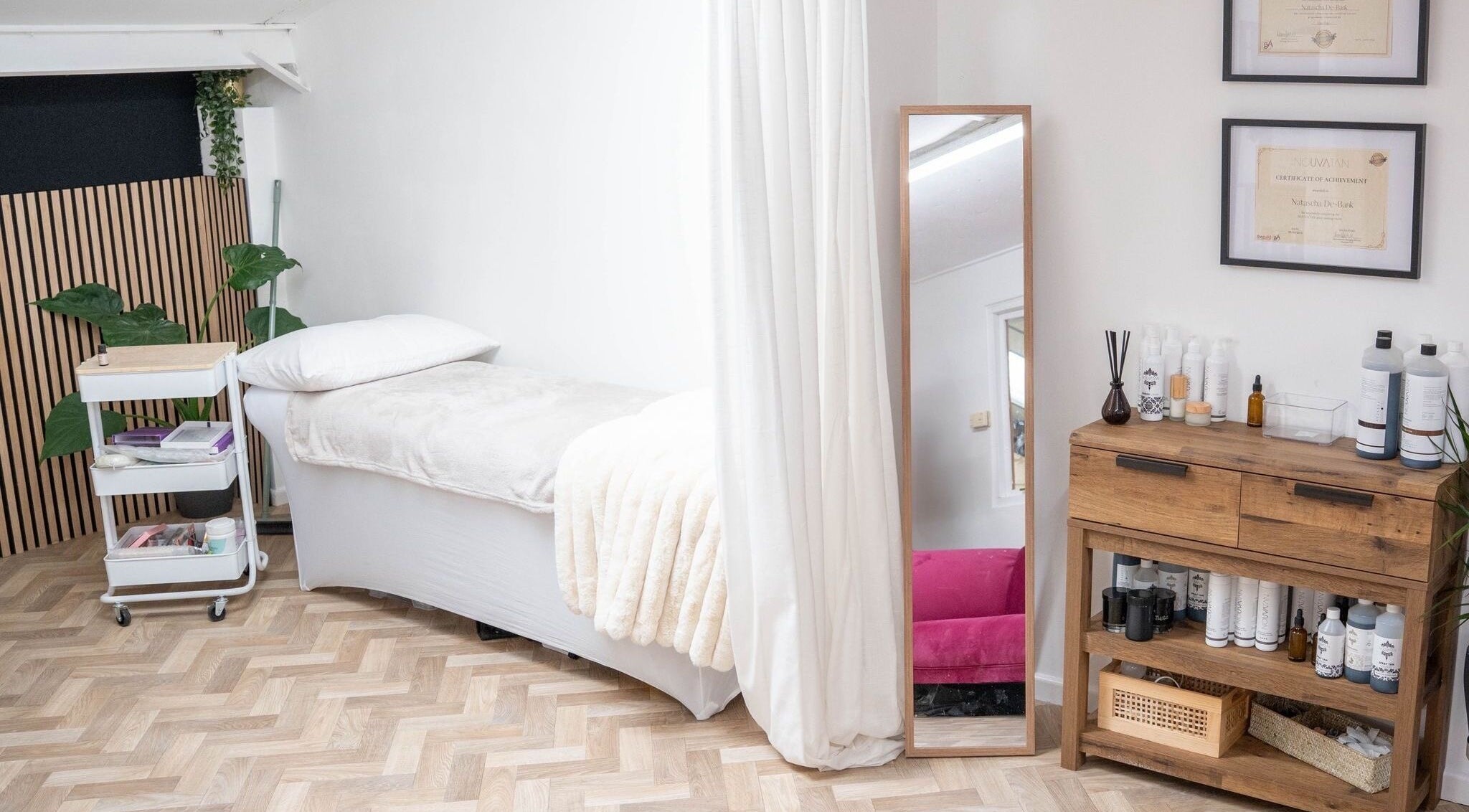 Cozy wellness room at Bay Co Beauty in Faringdon, England, GB, featuring a treatment bed and modern decor.