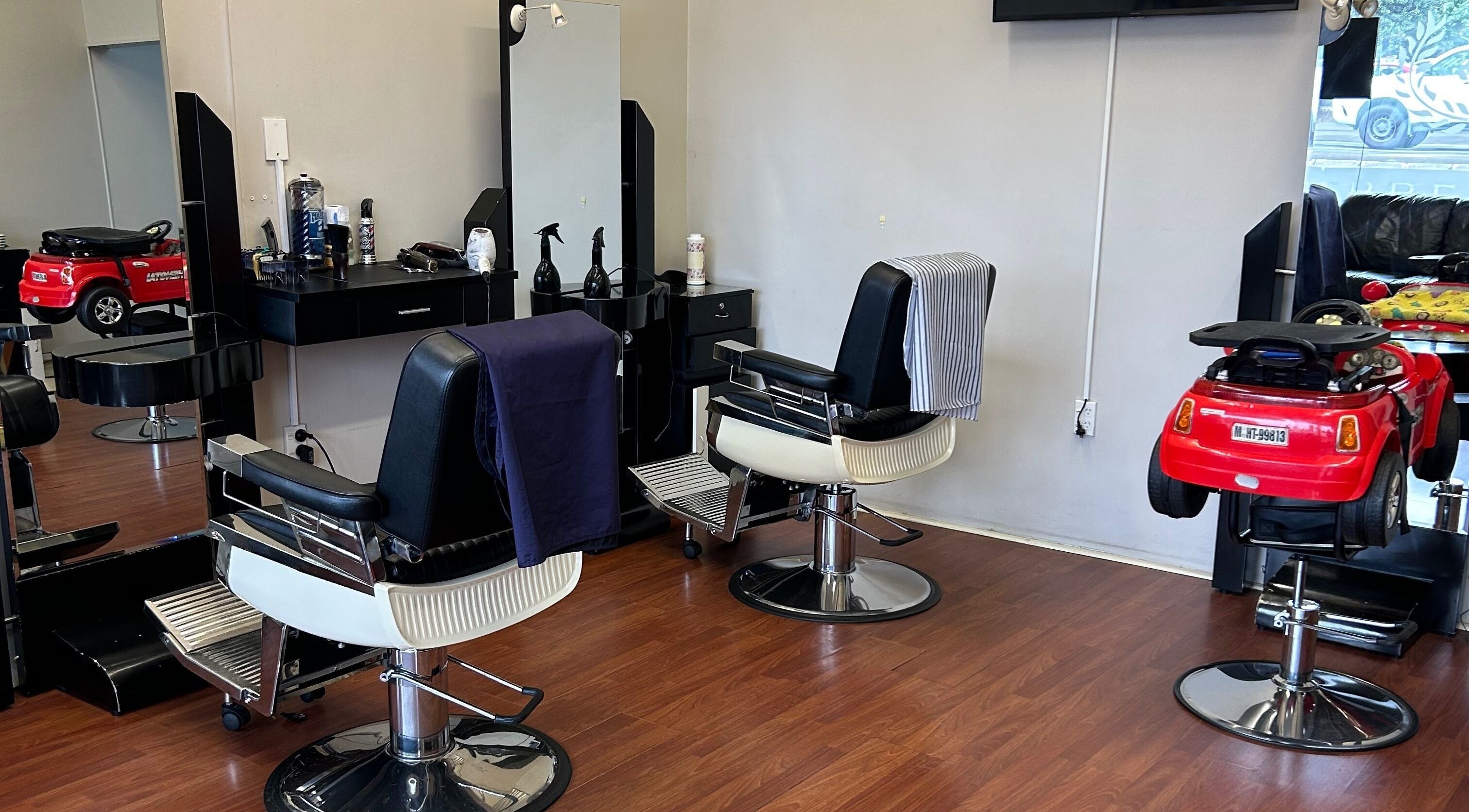 Modern salon interior at Hirals Hair and Beauty in Palmerston North, Manawatū-whanganui, NZ with stylish chairs.