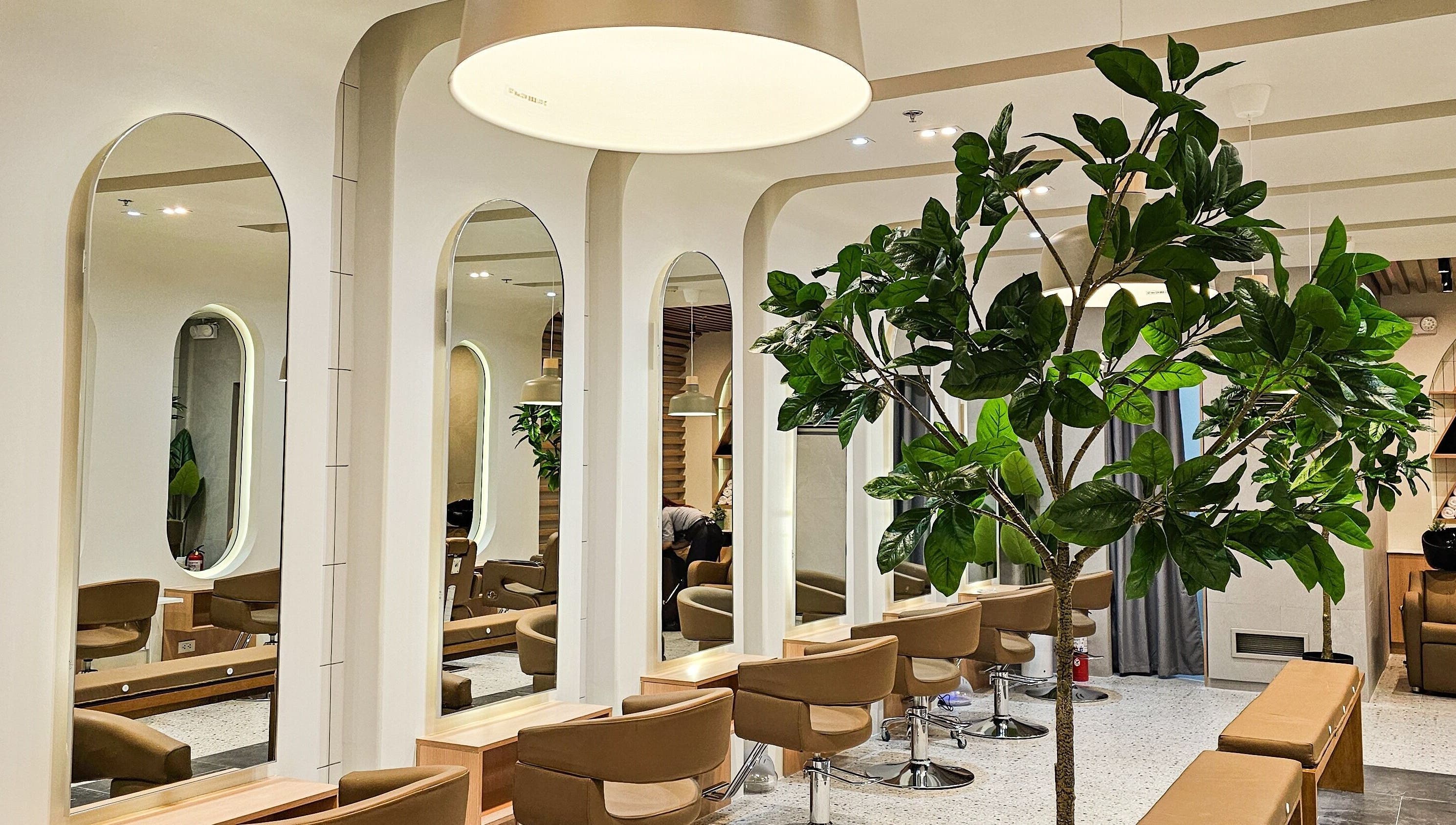 Azta Urban Salon interior with modern seating and mirrors, located in Makati, Metro Manila, PH.