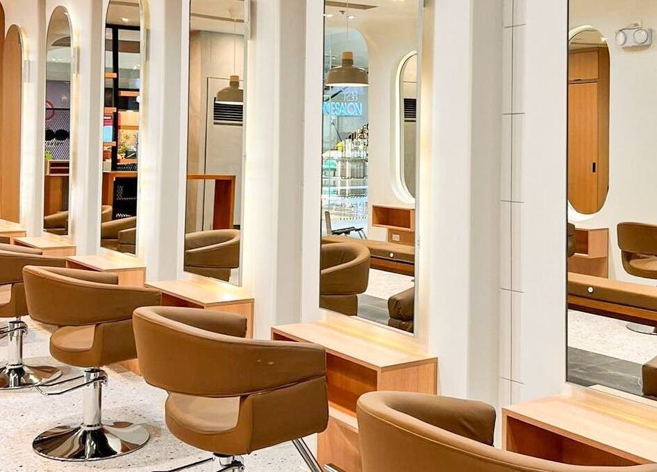 Stylish interior of Azta Urban Salon in Makati, Metro Manila, PH showcasing modern salon chairs and mirrors.
