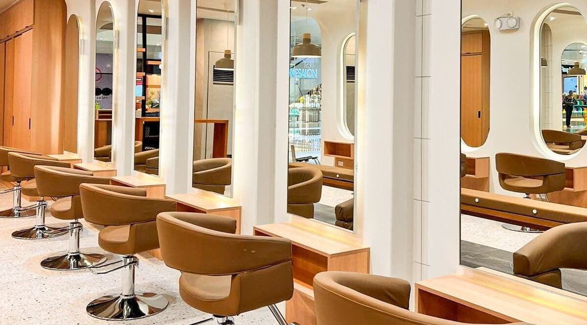 Stylish interior of Azta Urban Salon in Makati, Metro Manila, PH showcasing modern salon chairs and mirrors.