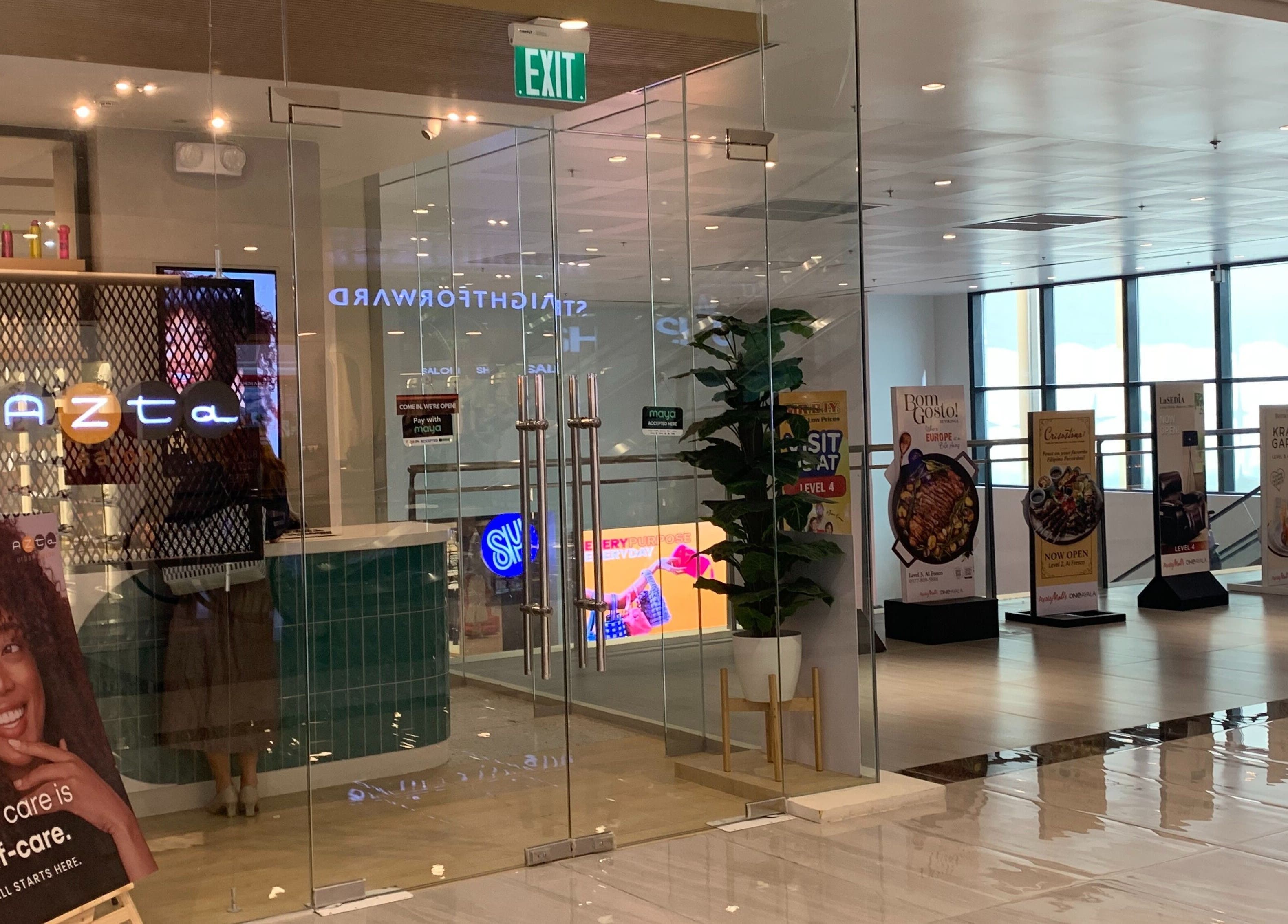 Azta Urban Salon entrance at Makati, Metro Manila, PH with stylish decor and inviting glass doors.
