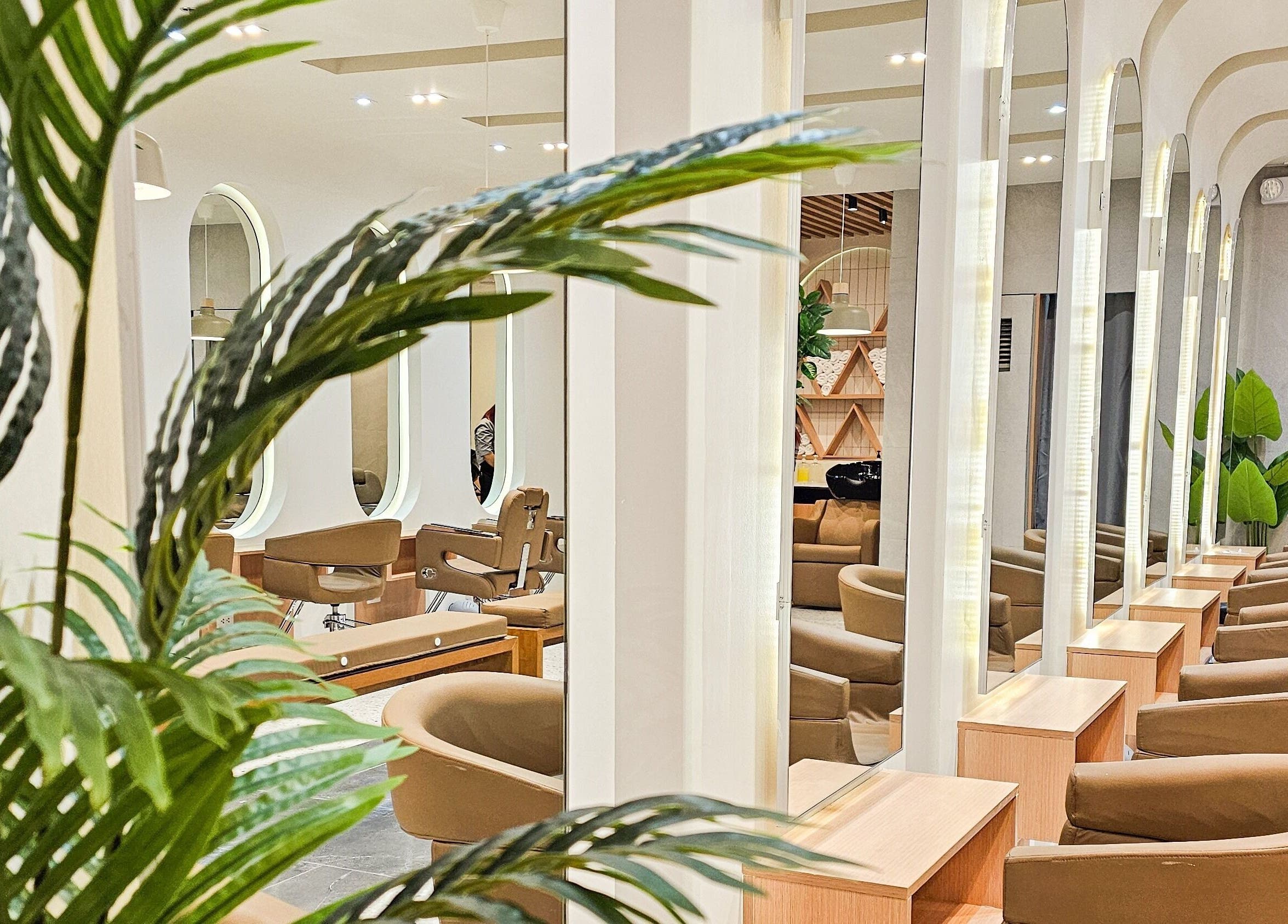 Interior of Azta Urban Salon - One Ayala in Makati, Metro Manila, PH, showcasing elegant salon chairs and mirrors.