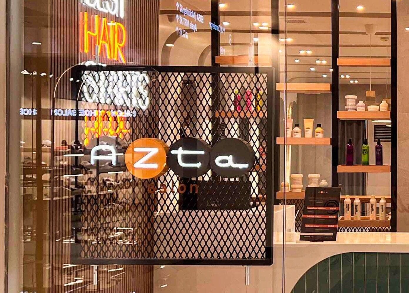 Entrance of Azta Urban Salon - One Ayala in Makati, Metro Manila, PH, displaying modern interior and products.