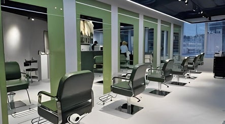Elegant salon interior with green chairs at The Beauty Salon By Andy, Hồ Chí Minh, Phường Bến Thành, VN.