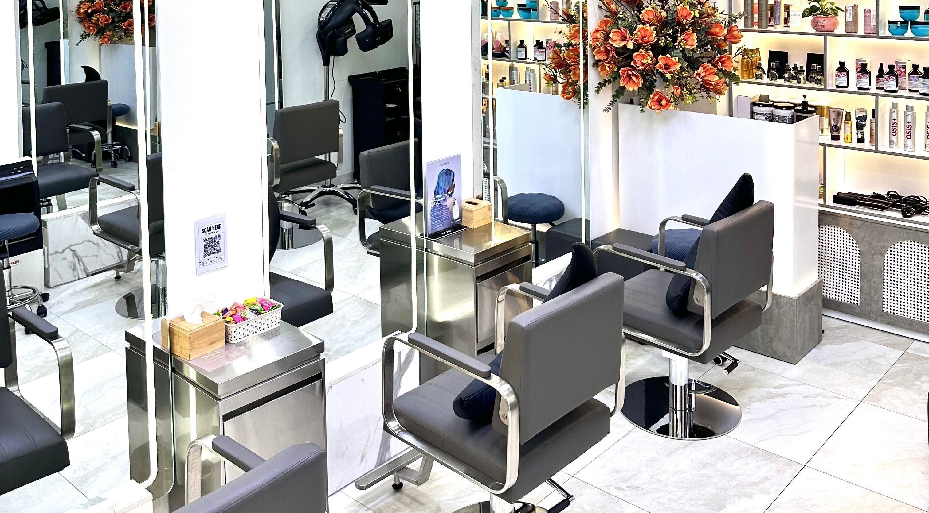 Modern salon chairs and mirrors at The Beauty Salon By Andy in Hồ Chí Minh, Hồ Chí Minh, VN.