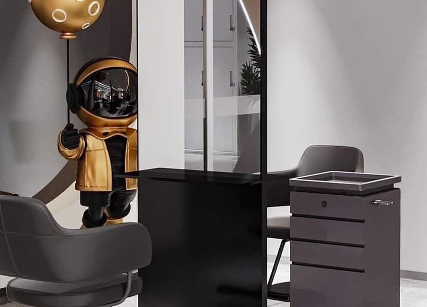 Modern salon setup with astronaut decor at The Beauty Salon By Andy, Hồ Chí Minh, Hồ Chí Minh, VN.