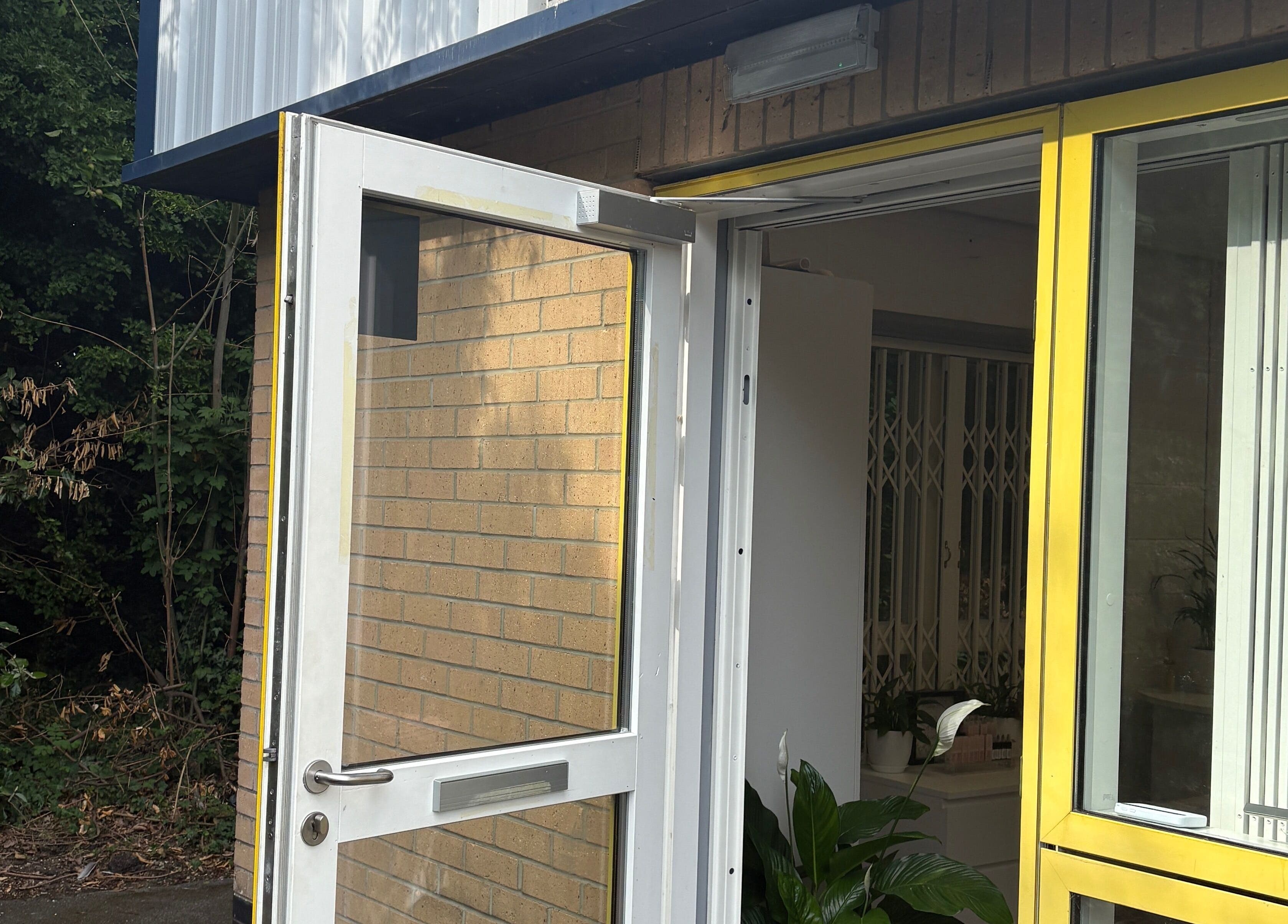 Entrance to Face Art Studio in Hersden, England, GB featuring an open door with a sunny ambiance.