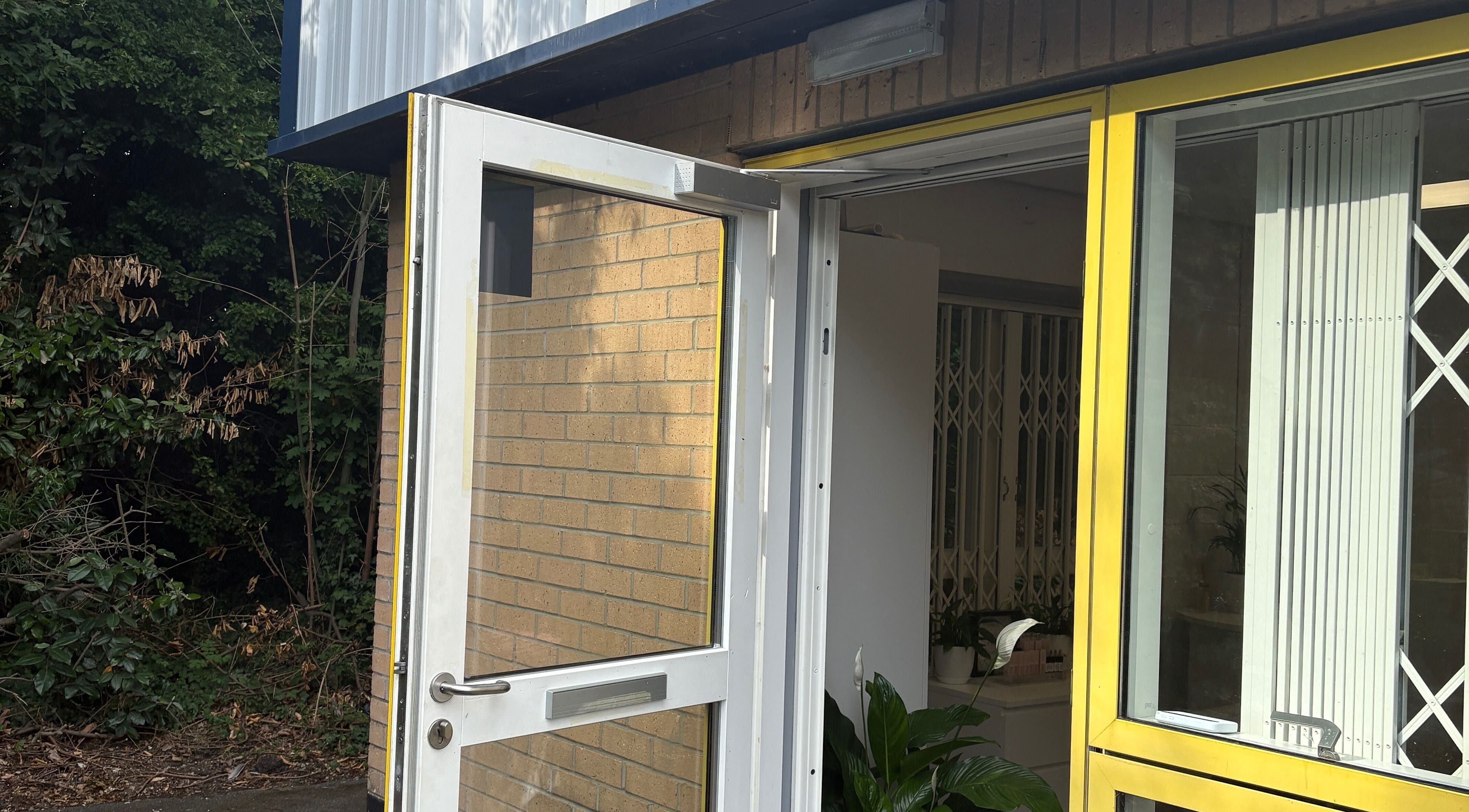 Entrance to Face Art Studio in Hersden, England, GB featuring an open door with a sunny ambiance.