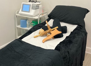 Massage tools on a treatment bed at Contour UK, Fazeley, England, GB, showcasing a serene wellness atmosphere.