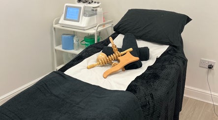 Massage tools on a treatment bed at Contour UK, Fazeley, England, GB, showcasing a serene wellness atmosphere.