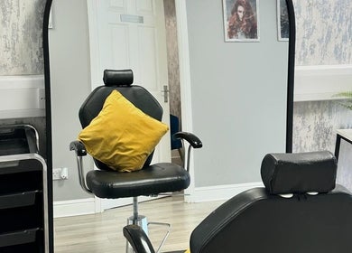 Modern salon chair and mirror setup at Contour UK, Fazeley, England, GB, highlighting stylish interior.