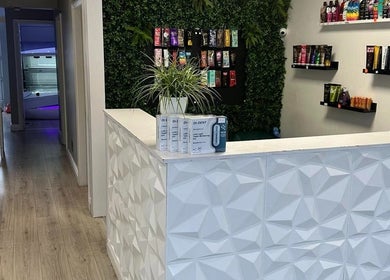 Modern reception area at Contour UK in Fazeley, England, GB with sleek design and beauty products displayed.