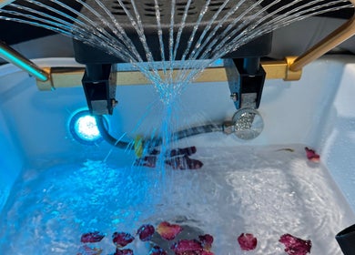 Luxurious foot spa at the Zen Den Ltd., Roseau, Saint George Parish, DM, with calming water jets and petals.