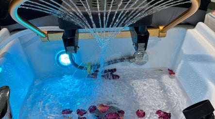 Luxurious foot spa at the Zen Den Ltd., Roseau, Saint George Parish, DM, with calming water jets and petals.